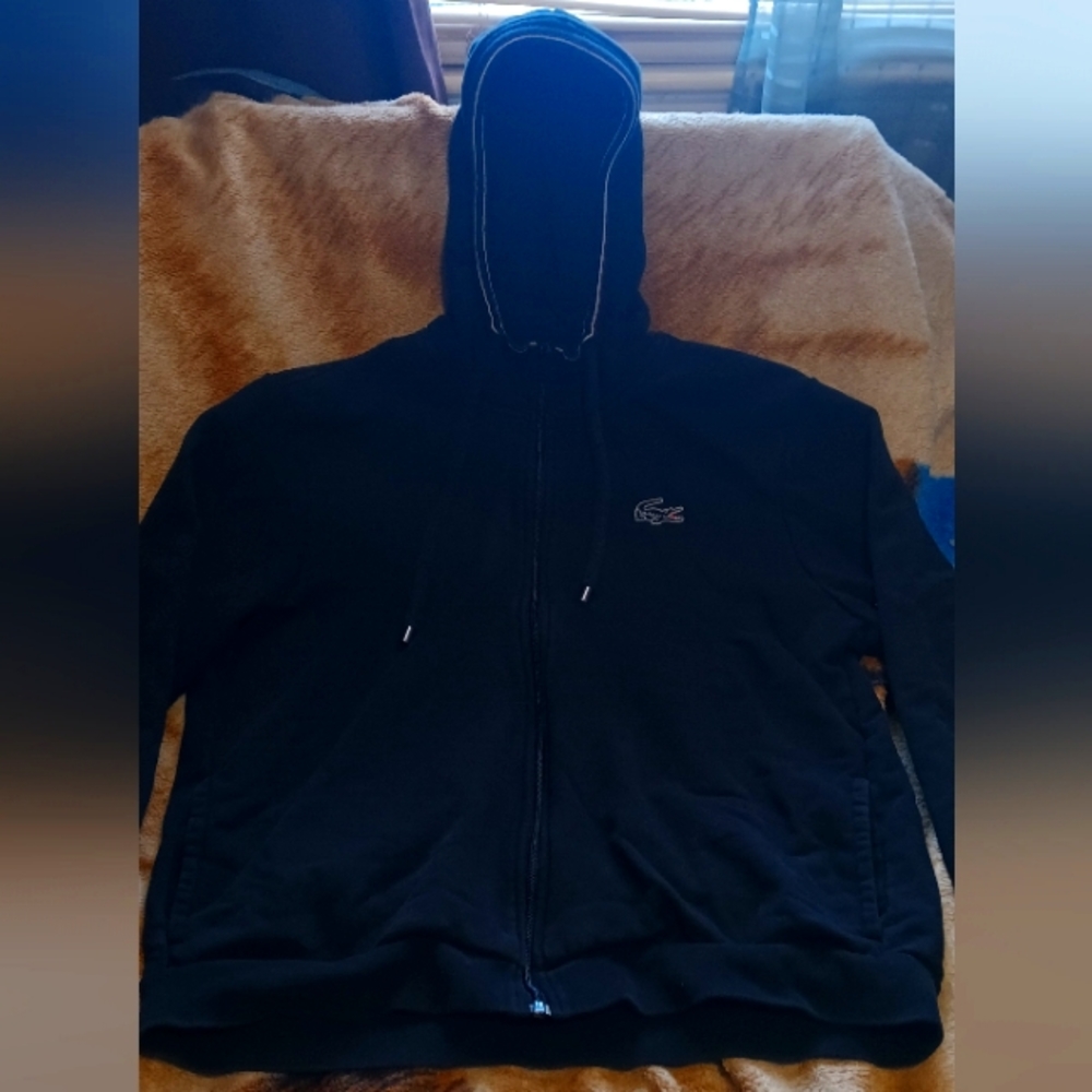 Lacoste, Men size (6) Large, and black in color.